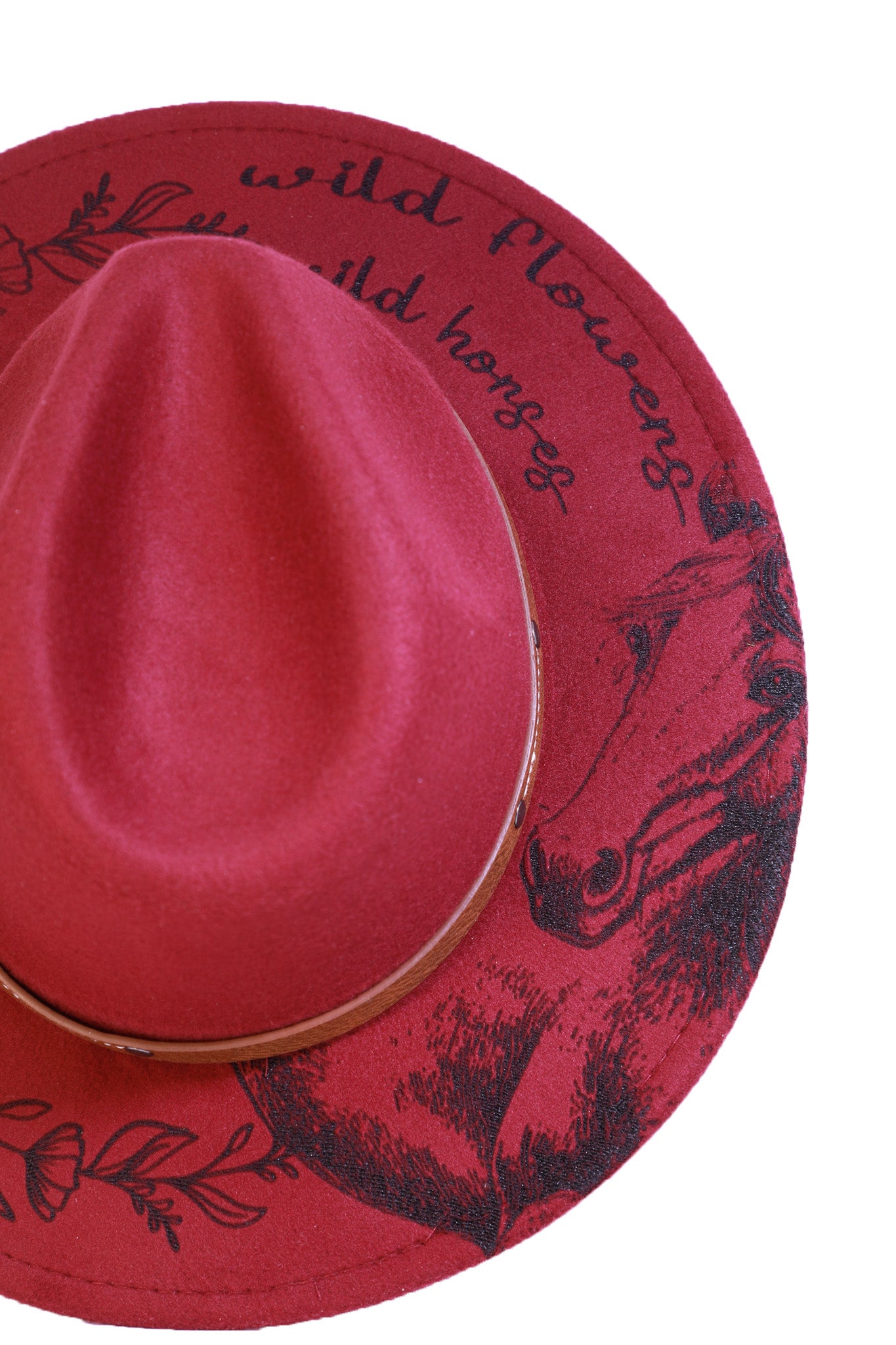 Side angle showing the floral engraving and brown faux-leather hat band