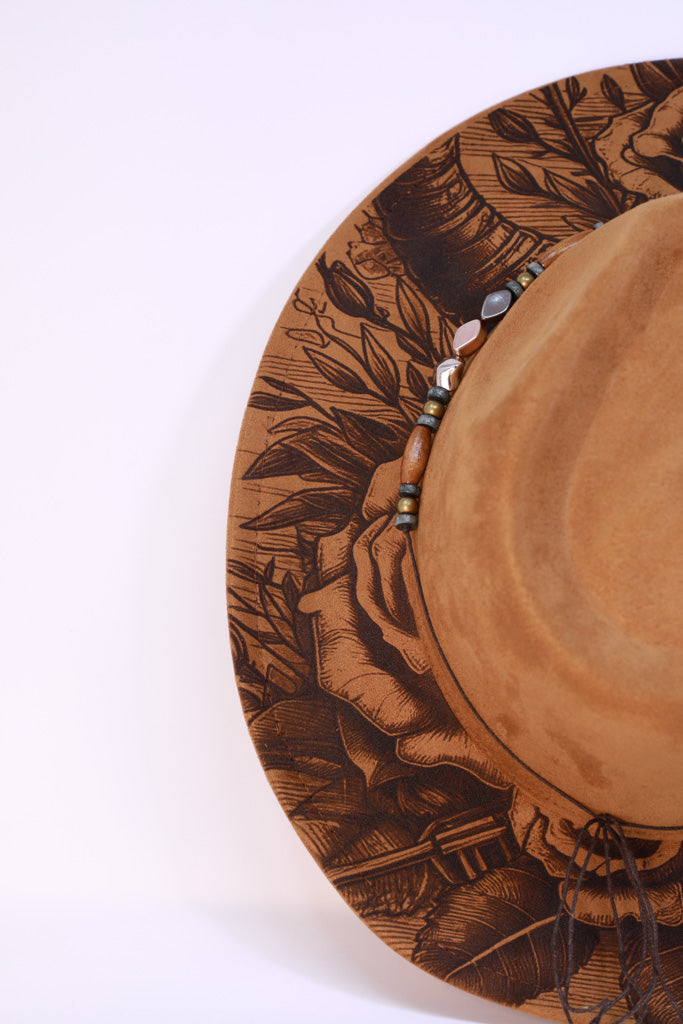 Side view showing engraved roses and horn pattern