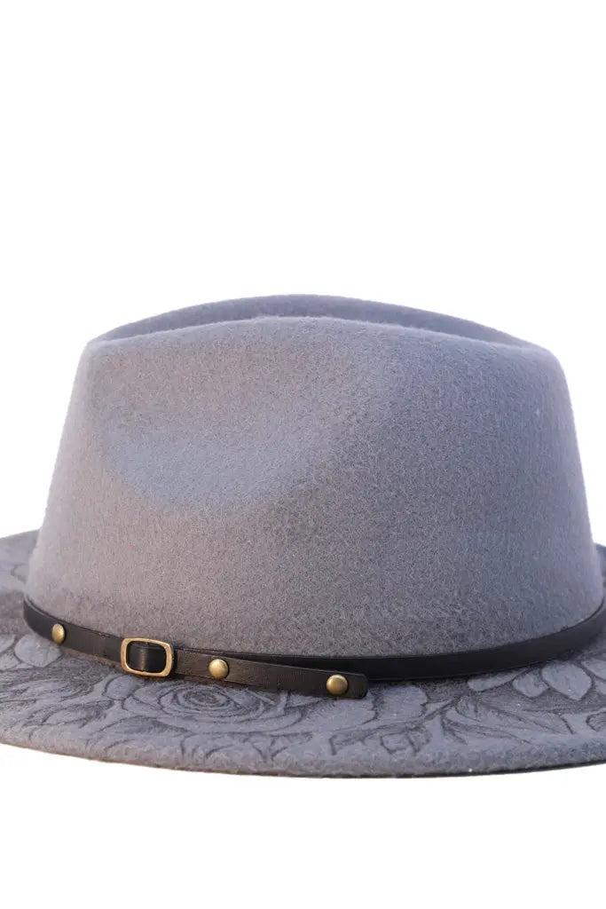 Side view of grey wool fedora with black strap and floral engraving