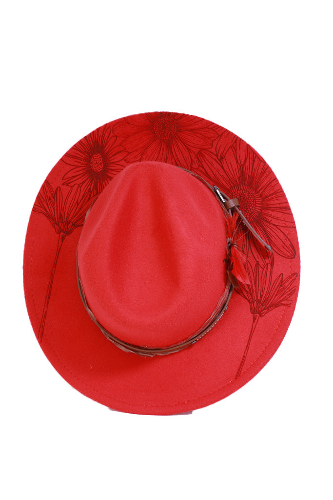Red fedora hat with laser engraved floral design on brim