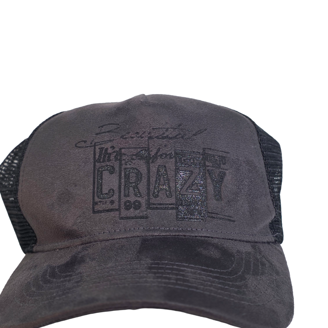 Gray trucker cap with Beautiful Crazy text on a white background
