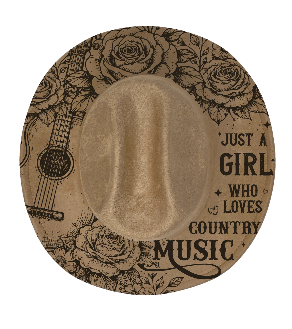 Tan coloured cattleman hat with guitar and roses engraved on it and the text just a girl who loves country music