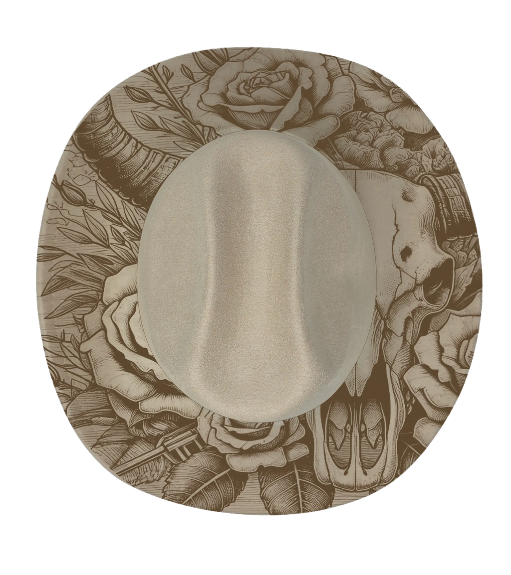 A biege cattleman hat with a longhorn and floral pattern engraved onto the brim
