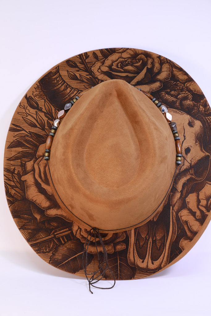 Detail of floral engraving on brim edge