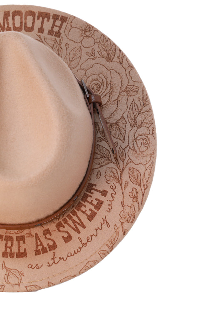 Detailed floral and text engraving around fedora brim