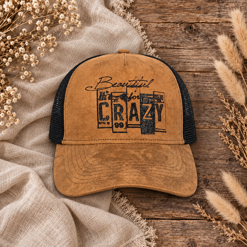 Beautiful Crazy Suede Trucker Hat on a cream flat-lay background