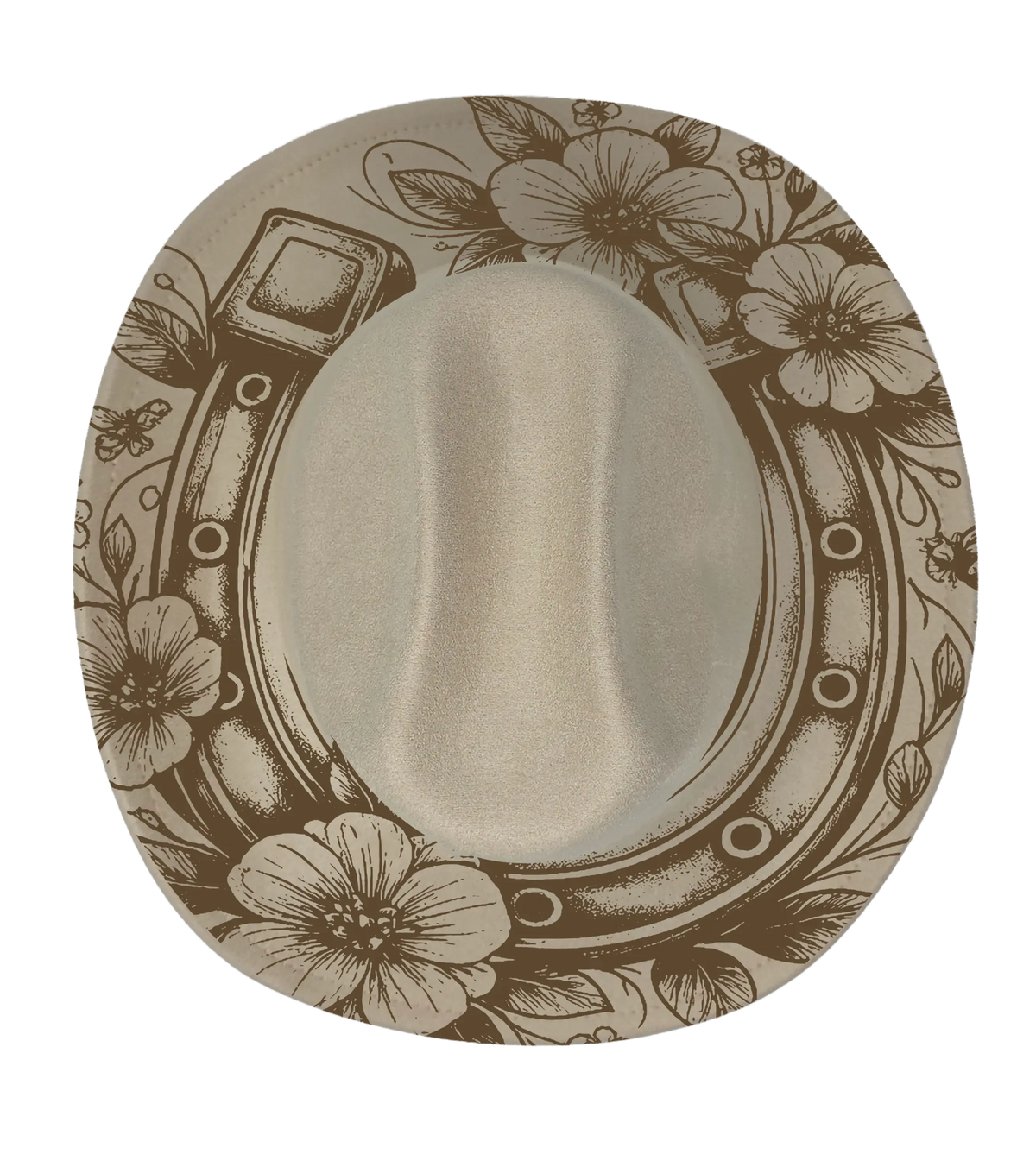 A biege cattleman hat with a horseshoe and floral pattern engraving on the brim