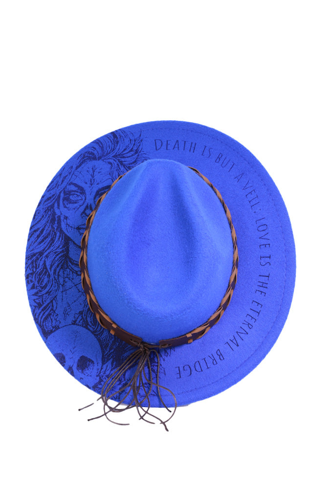 Blue fedora with braided brown hatband and turquoise concho