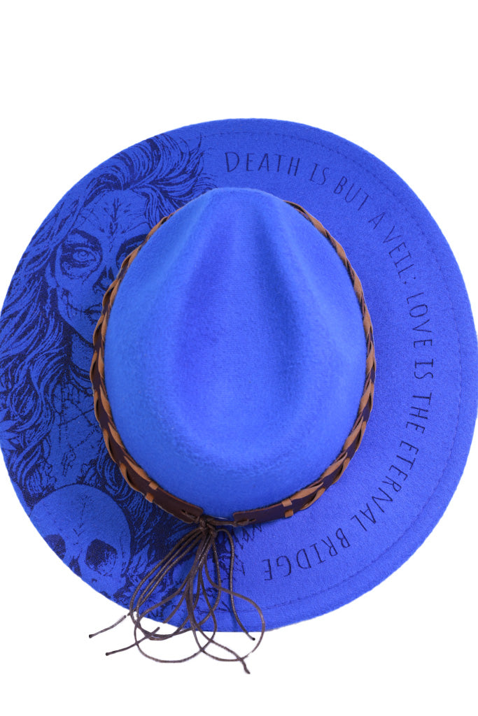 Close-up of “Death is but a veil; love is the eternal bridge” quote on brim