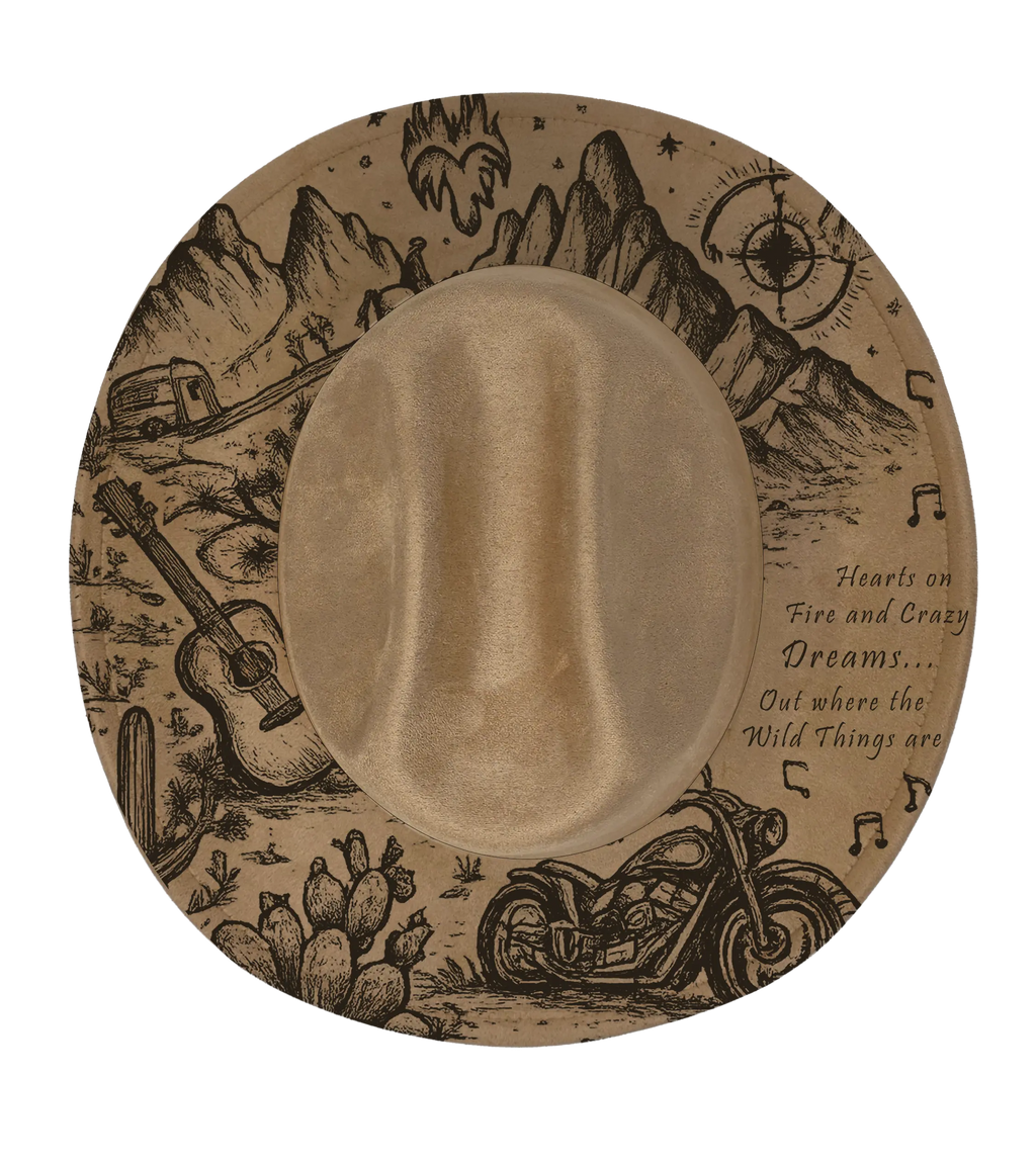 Tan colour cattleman hat with mountain and desert scene engraved with the words heart is on fire and crazy dreams