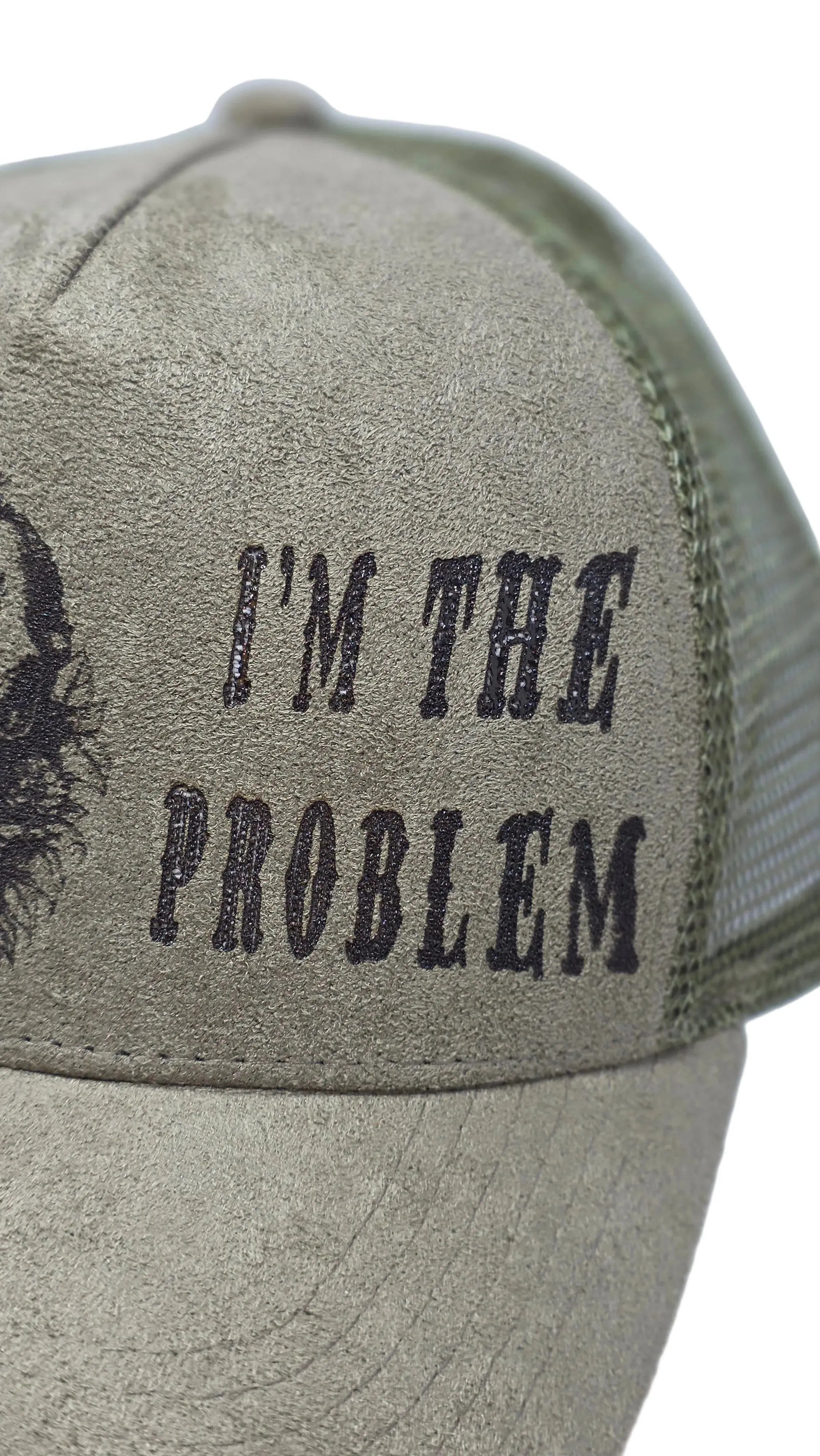 Green Cap with "Im the problem" engraved on a white background 