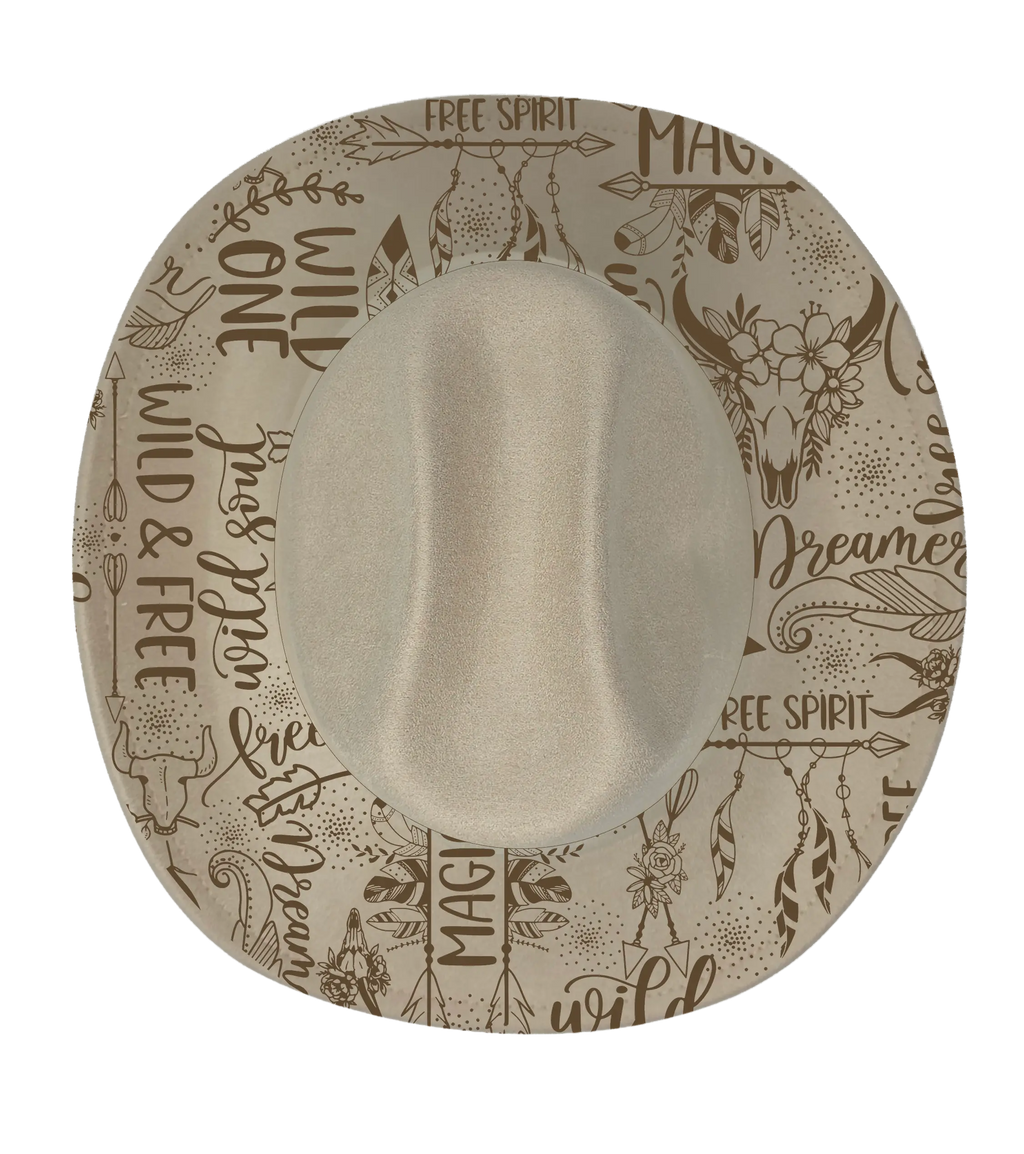 Cream cattleman hat with wild one and free spirit graphic engraved onto the brim